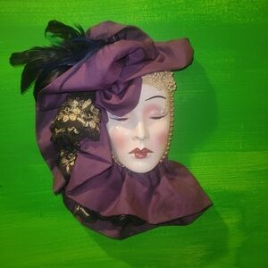Elagant Lady Wall Mask Adorned with Purple Fabric, Feathers & Beading.